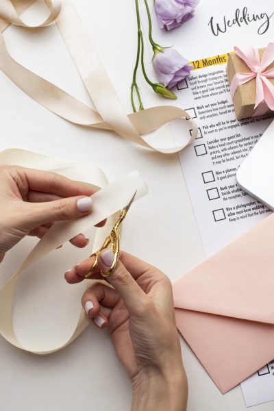 feminine-hands-creating-handmade-invitations